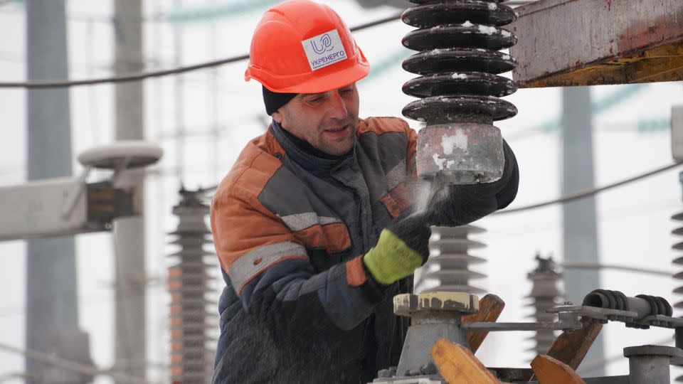 In this undated photo, an employee at Ukraine’s state-owned grid operator, Ukrenergo, works on the power grid. - Courtesy Ukrenergo