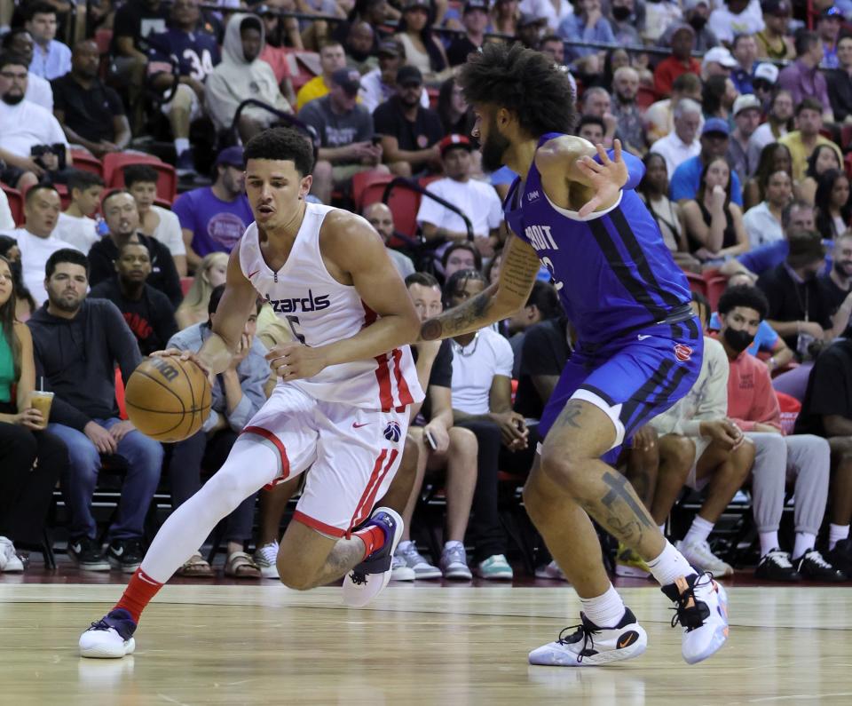 Wizards guard Johnny Davis drives against Pistons forward Isaiah Livers during the Summer League game on Saturday, July 9, 2022, in Las Vegas.