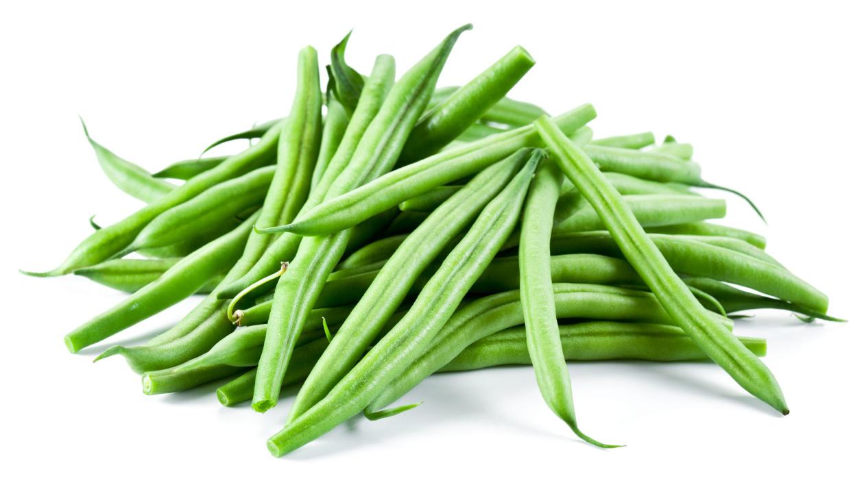 Pile of raw green beans isolated on white background.
