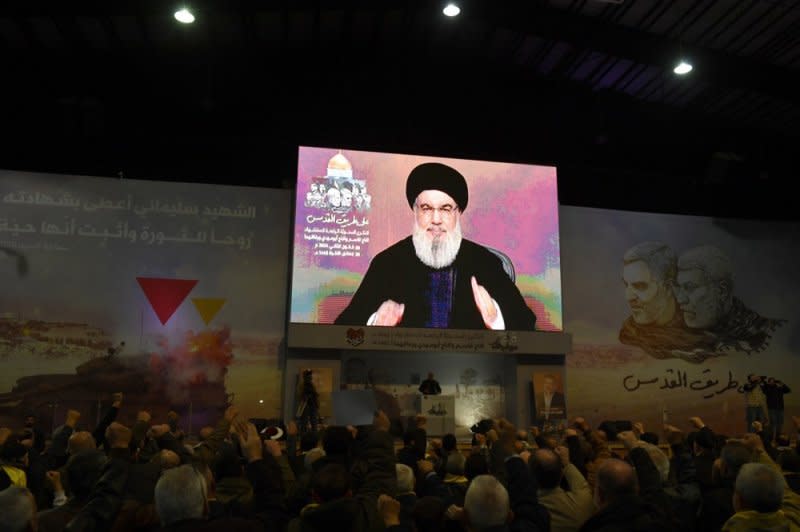 Crowds watch a televised speech of Hezbollah secretary general Seyyed Hasan Nasrallah during an event to mark the fourth anniversary of top Iranian commander Qasem Soleimani's death near Beirut, Lebanon, on Wednesday. Photo by Abbas Salman/EPA-EFE