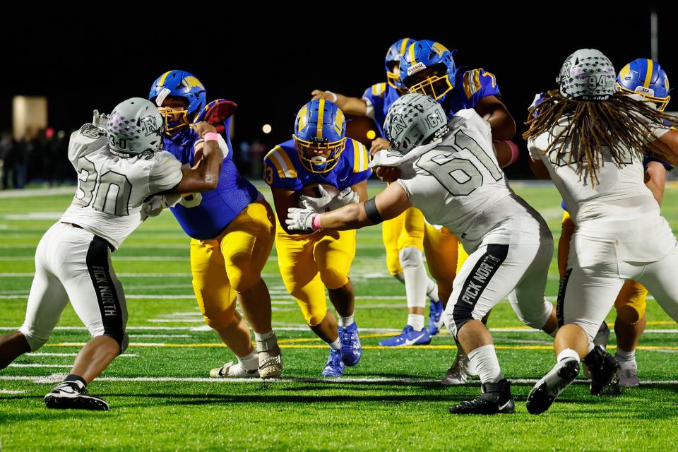 Gahanna Lincoln’s Jayden Lewis carries the ball against Pickerington North on Friday.