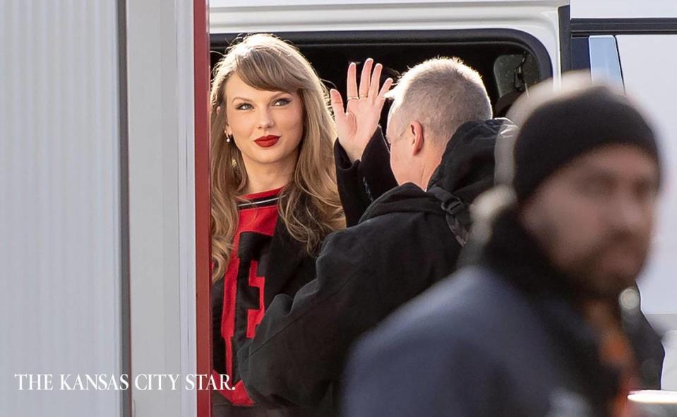 Taylor Swift gives onlookers a little wave as she arrives at GEHA Field at Arrowhead Stadium to watch boyfriend Travis Kelce and the Kansas City Chiefs play the Buffalo Bills on Dec. 10.