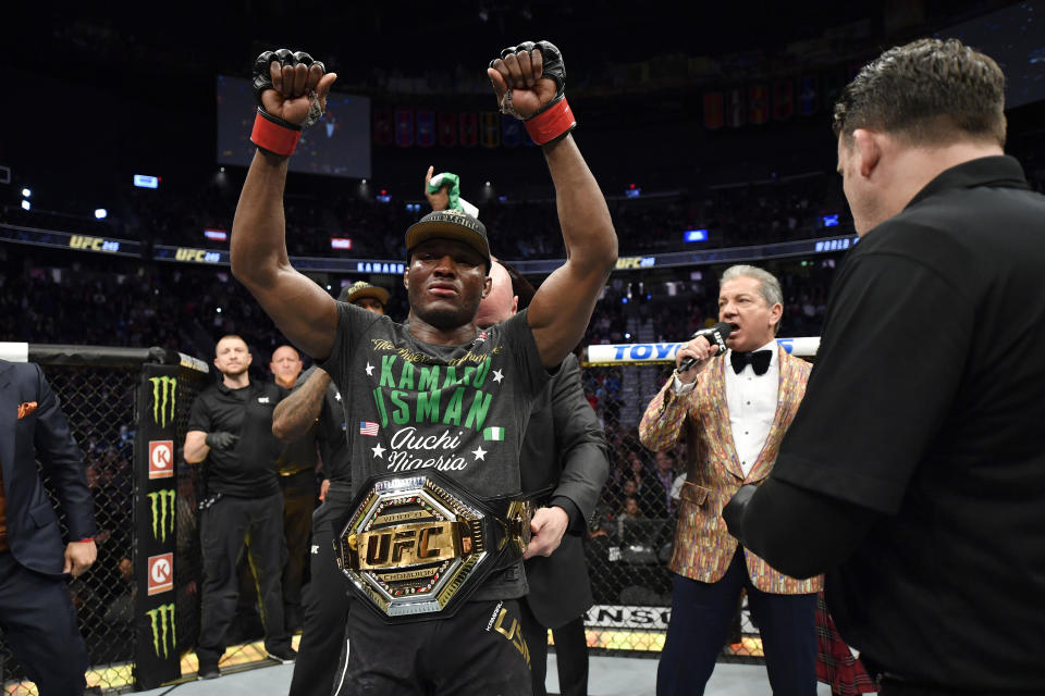 LAS VEGAS, NEVADA - DECEMBER 14:  Kamaru Usman of Nigeria raises his hand in victory over Colby Covington in their UFC welterweight championship bout during the UFC 245 event at T-Mobile Arena on December 14, 2019 in Las Vegas, Nevada. (Photo by Jeff Bottari/Zuffa LLC via Getty Images)