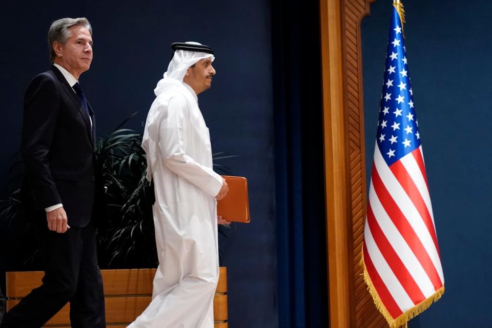 U.S. Secretary of State Antony Blinken, left, and Qatar's Prime Minister and Foreign Minister Mohammed bin Abdulrahman Al Thani arrive for the statements to the media in Doha, Qatar, Friday Oct. 13, 2023.
