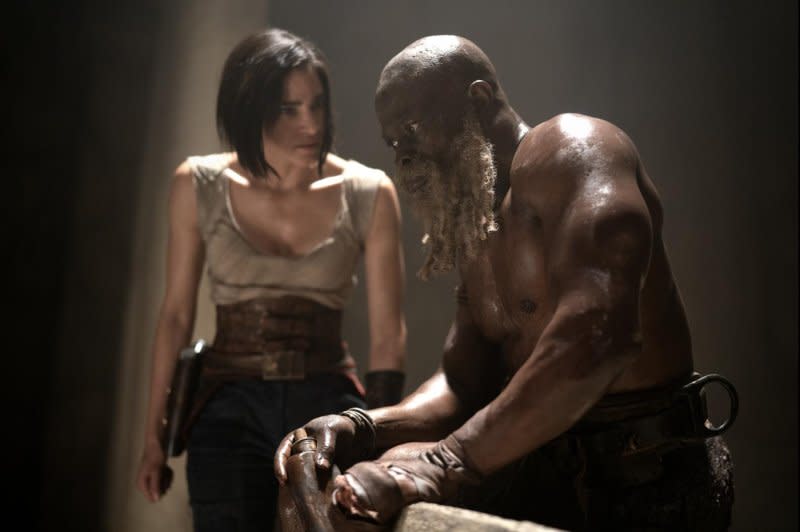 Kora (Sofia Boutella) recruits General Titus (Djimon Hounsou). Photo courtesy of Netflix