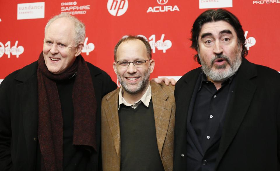 Writer and director Ira Sachs, center, poses with cast members John Lithgow, left, and Alfred Molina, right, at the premiere of the film "Love is Strange" during the 2014 Sundance Film Festival, on Saturday, Jan. 18, 2014 in Park City, Utah. (Photo by Danny Moloshok/Invision/AP)