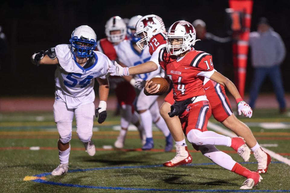 Holliston senior quarterback Kaua Lima runs the ball during the Division 4 football quarterfinal against Scituate at Holliston High School, Nov. 10, 2023.