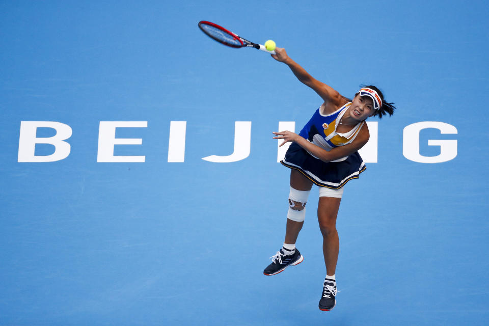 FILE - Peng Shuai of China serves against Monica Niculescu of Romania during their women's singles match of the China Open tennis tournament at the Diamond Court in Beijing, Wednesday, Oct. 4, 2017. The head of the women’s professional tennis tour announced Wednesday, Dec. 1, 2021, that all WTA tournaments would be suspended in China because of concerns about the safety of Peng Shuai, a Grand Slam doubles champion who accused a former high-ranking government official in that country of sexual assault. (AP Photo/Andy Wong, File)