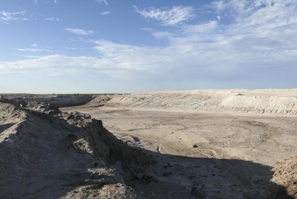 An orphaned well in Crane County began spewing produced water in 2021. The salty water covered a large area that required remediation. The salty soil was excavating, leaving this pit.