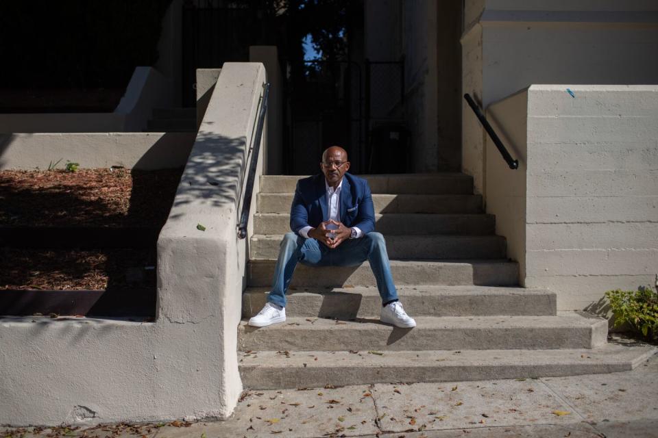 Gang interventionist Tim Kornegay sits on the steps of McCarty Memorial Christian Church