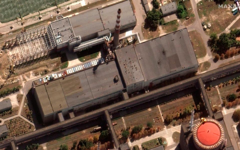 Images released on Monday appear to show holes in the roof of the right-hand building at the Zaporizhzhia nuclear plant - MAXAR/AP