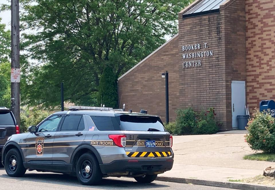 A Pennsylvania State Police cruiser parks next to the Booker T. Washington Center at East 18th and Holland streets in Erie on June 7. State police helped investigators with the U.S. Department of Education search the center and the Erie Rise Leadership Academy Charter School, at West 10th and Cascade streets, on June 7. The Department of Education has released no updates on the probe.