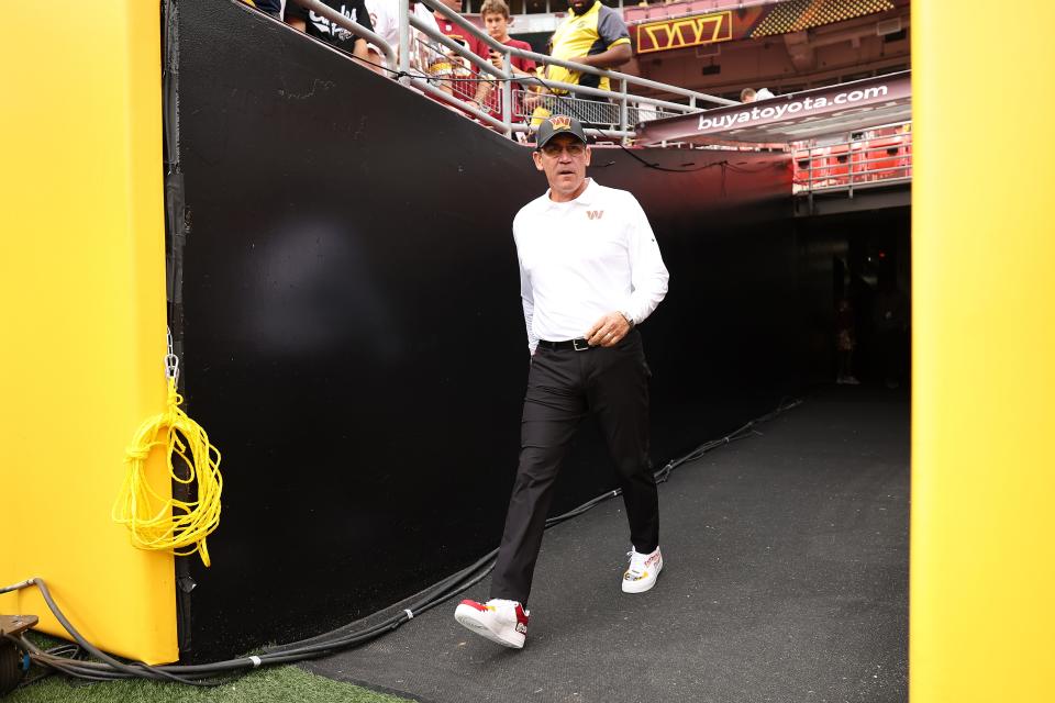 Head coach Ron Rivera of the Washington Commanders walks onto the field during pregame at FedExField.