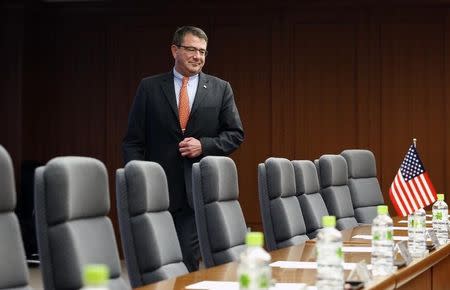 Ashton Carter walks towards his seat at the start of a meeting with Japanese Senior Vice Defence Minister Shu Watanabe (not pictured) in Tokyo July 20, 2012. REUTERS/Yuriko Nakao