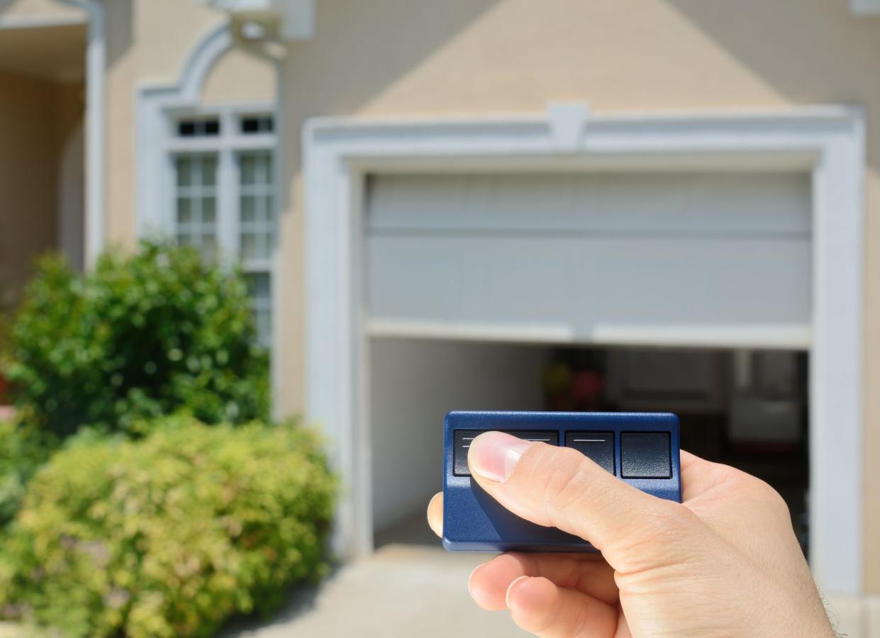 Garage Door Opener opening a residential garage door.