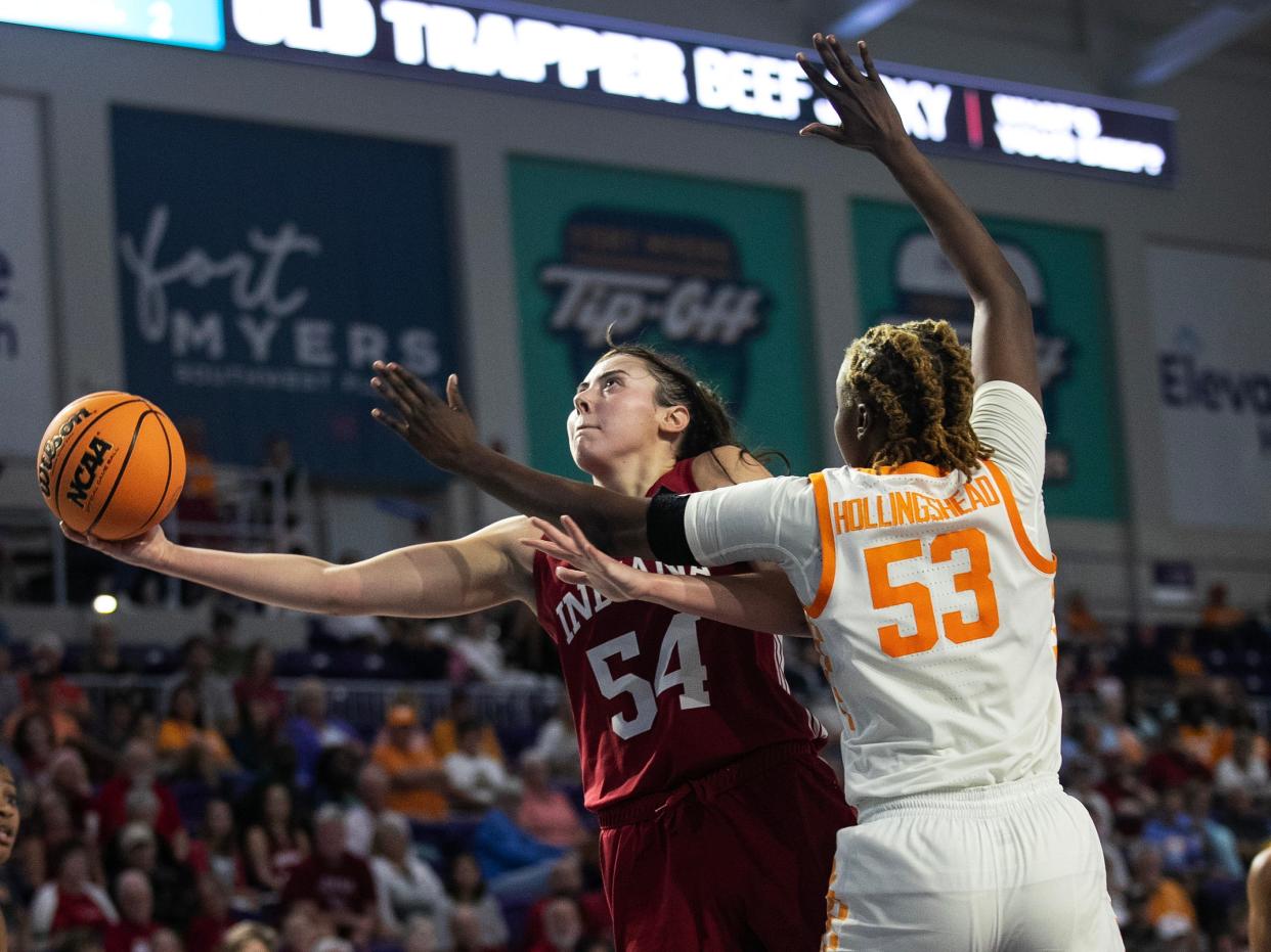 Mackenzie Holmes of Indiana is fouled by Jillian Hollingshead of Tennessee in the Elevance Health Women's Fort Myers Tip-Off Tournament on Thursday, Nov. 23, 2023, at Suncoast Credit Union Arena in Fort Myers.