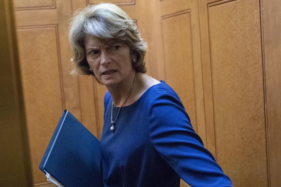 Sen. Lisa Murkowski, R-Alaska, turns to answer a reporter's question after the Democratic policy luncheon on Capitol Hill, Wednesday, Oct. 10, 2018 in Washington. Murkowski is brushing back against President Donald Trump, saying she knows her state's political terrain "better than he does." Trump says voters "will never forgive" Murkowski for opposing Brett Kavanaugh's nomination to the Supreme Court, and he says the senator will "never recover" politically. (AP Photo/Alex Brandon)