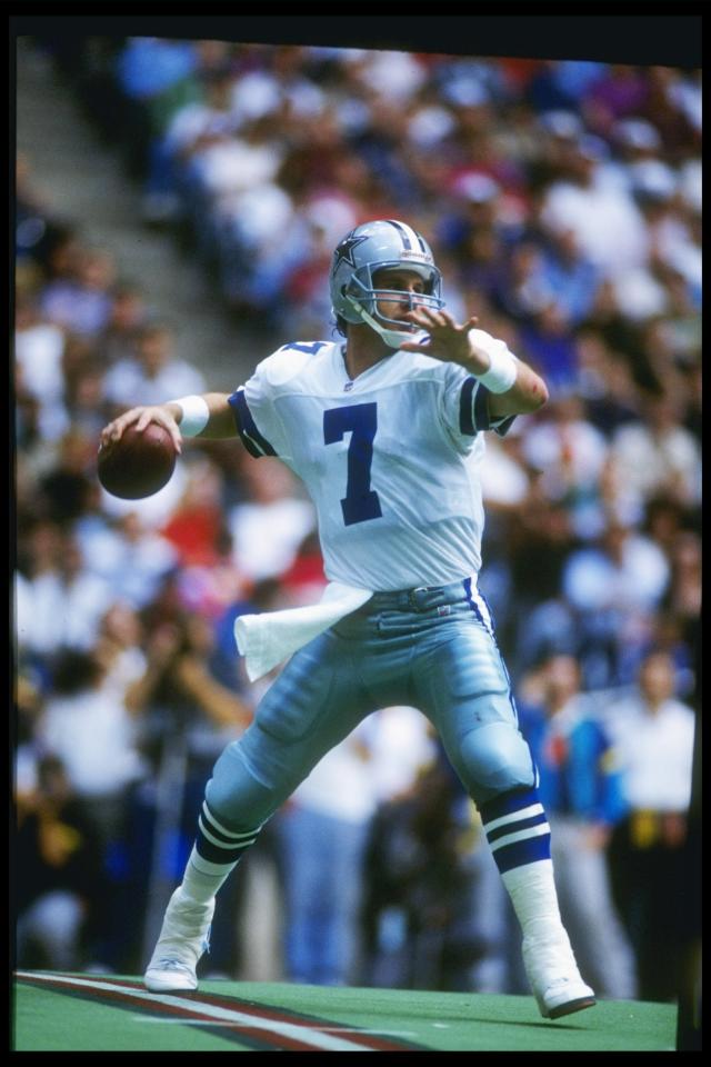 Troy Aikman of the Dallas Cowboys looks to pass against the