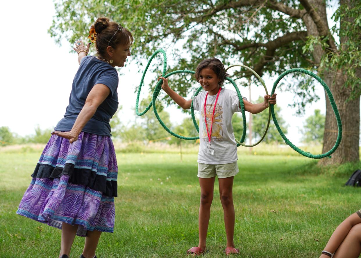 A girl learns to hoop dance during the South Dakota Urban Indian Health summer culture camp in Sisseton.