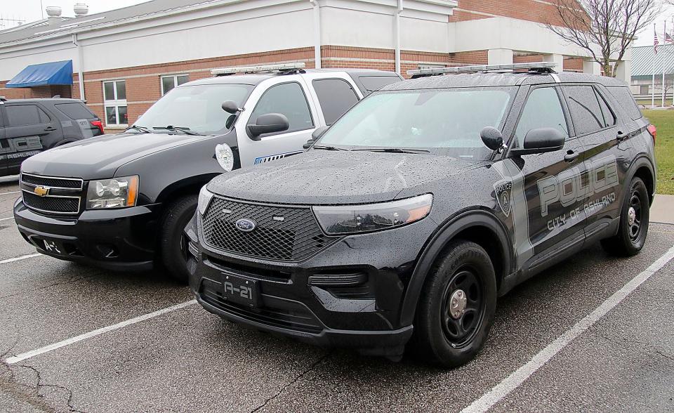 One of the older Ashland Police Department cruisers with the new decal is seen next to one of the older style decals on a cruiser.