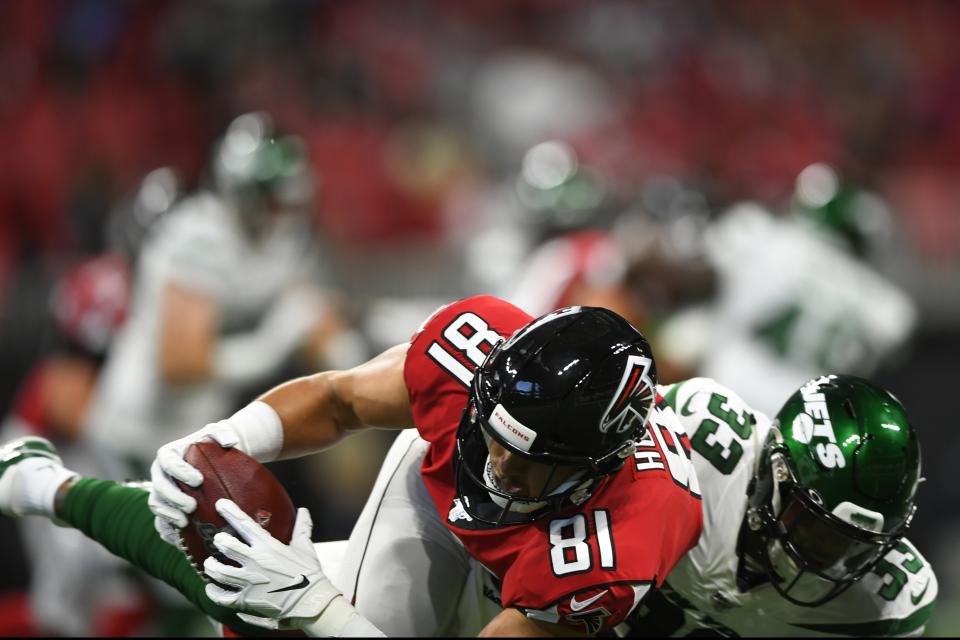 Atlanta Falcons tight end Austin Hooper (81) makes the catch against New York Jets strong safety Jamal Adams (33) during the first half an NFL preseason football game, Thursday, Aug. 15, 2019, in Atlanta. (AP Photo/John Amis)