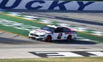 Brad Keselowski crosses the finish line during qualifying for a NASCAR Series auto race at Kentucky Speedway in Sparta, Ky., Friday, July 12, 2019. (AP Photo/Timothy D. Easley)