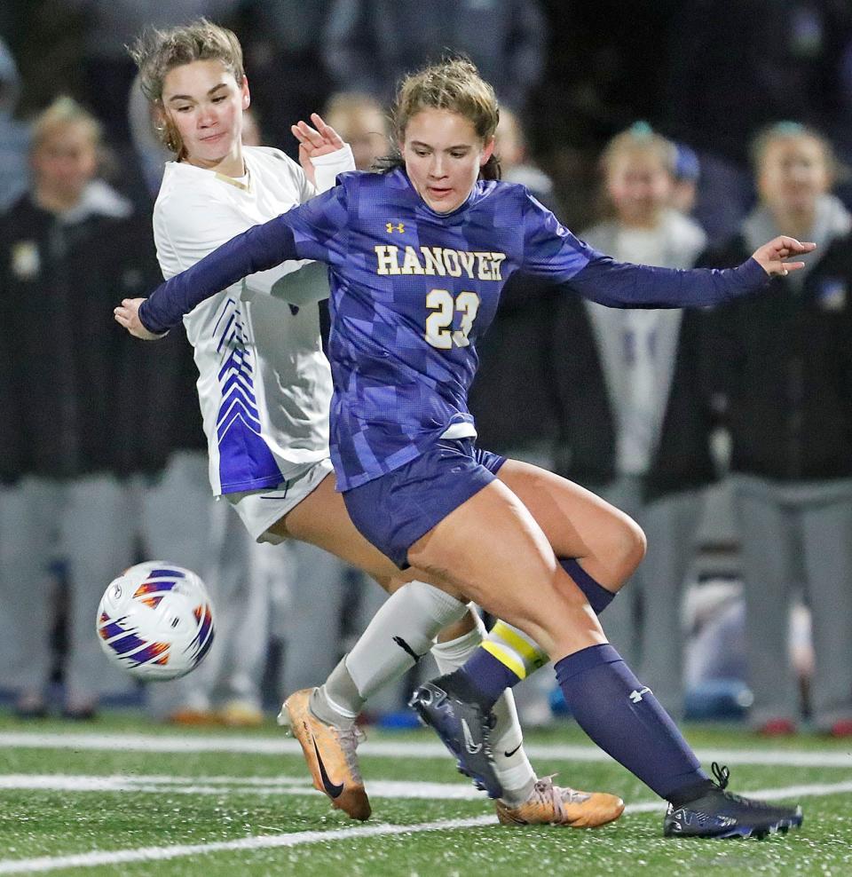 Hanover captain Erin Condon tries to shield Norwell's Kelsey Tuttle from the ball. Norwell girls soccer wins the Division 3 state championship by defeating Hanover 1-0 in Scituate on Saturday, Nov. 18, 2023.