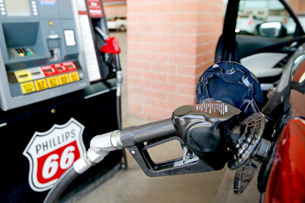 A motorist fills up a vehicle June 23, 2022, at a gas station in Oklahoma City.