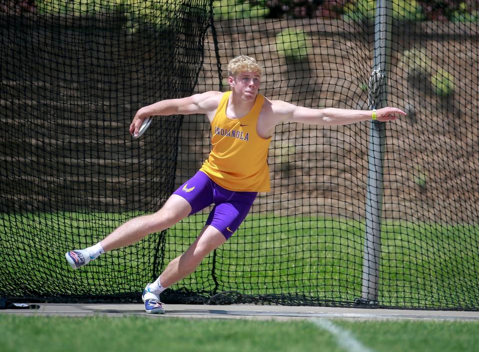 Indianola's Walker Whalen launches a state-record throw to win the Class 4A discus championship at the state high school track and field meet at Drake Stadium on Thursday.