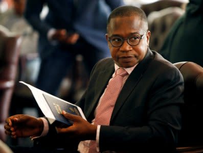 FILE PHOTO: Zimbabwean Finance Minister Mthuli Ncube looks on before the swearing in of new cabinet ministers at State House in Harare, Zimbabwe, September 10, 2018. REUTERS/Philimon Bulawayo/File Photo