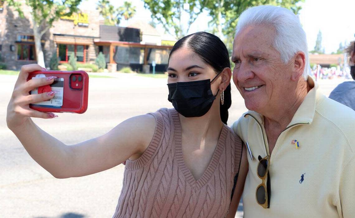 Desiree Grimaldo of Madera takes a selfie with Rep. Jim Costa at the Rally for Roe on the corner of Blackstone and Nees on May 14, 2022.