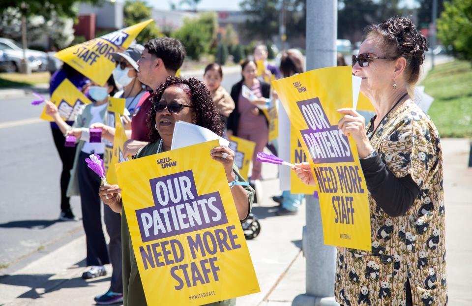 Kaiser Permanente employees walk a picket line outside of the hospital on West Lane near Hammer Lane in Stockton on Tuesday, July 25, 2023. The employees are in contract negotiations with Kaiser Permanente to get more staffing. About 300 Stockton employees joined others from Manteca and Vacaville on Tuesday, and those from Modesto and south Sacramento on Wednesday.