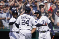 Detroit Tigers designated hitter Miguel Cabrera greets teammates after being pulled for a pinch runner during the sixth inning of the first baseball game of a doubleheader against the Colorado Rockies, Saturday, April 23, 2022, in Detroit. (AP Photo/Carlos Osorio)