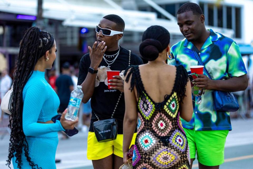 From. left, Emely, Dave, Genesis, Tae meet for the first time on Ocean Drive while on vacation during Memorial Day weekend at Miami Beach, Florida, on Sunday, May 28, 2023. Dave and Tae came from Chicago while Emely and Genesis flew in from New Jersey.