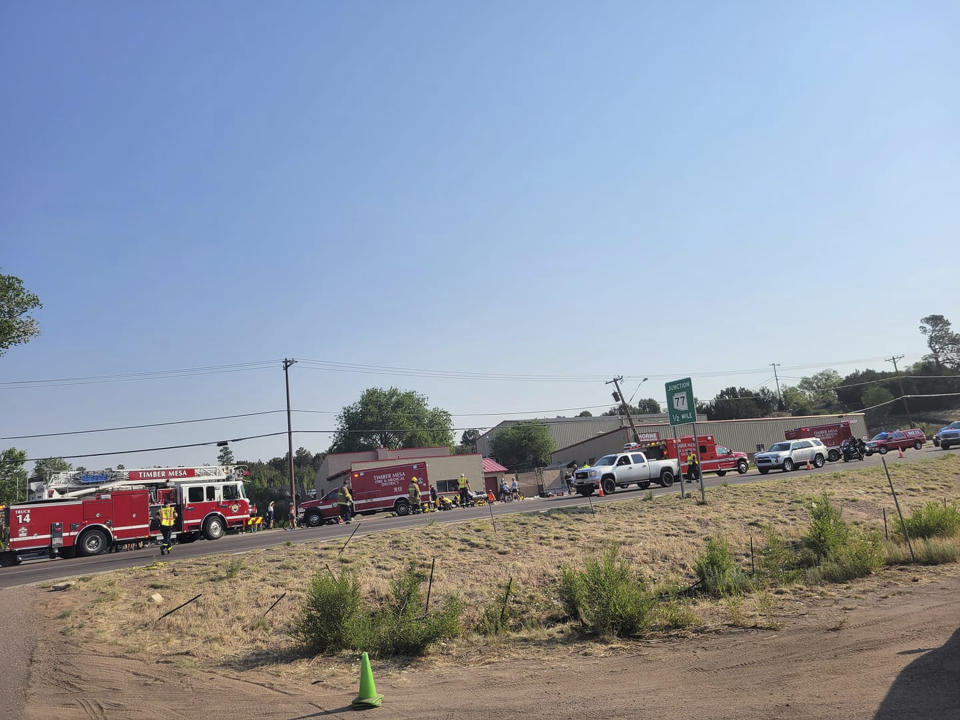 This Saturday, June 19, 221, photo released by the Timber Mesa Fire and Medical District shows emergency personnel at the scene of a mass casualty incident near Downtown 9 in Show Low, Ariz., Saturday, June 19, 2021. Police say a driver in a pickup truck has plowed into bicyclists competing in a community road race in Arizona, critically injuring several riders. Authorities say officers then chased down the driver and shot him outside a nearby hardware store. Police say six cyclists have been taken to a hospital in critical condition after the crash in the mountain town, northeast of Phoenix. The 35-year-old suspect also has been hospitalized in critical condition. (Timber Mesa Fire and Medical District via AP)