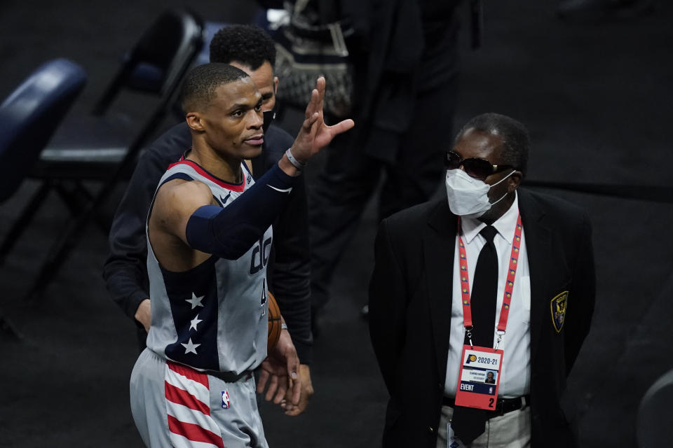 Washington Wizards' Russell Westbrook waves to fans as he leaves the court following an NBA basketball game against the Indiana Pacers, Saturday, May 8, 2021, in Indianapolis. Washington won 133-132 in overtime. (AP Photo/Darron Cummings)