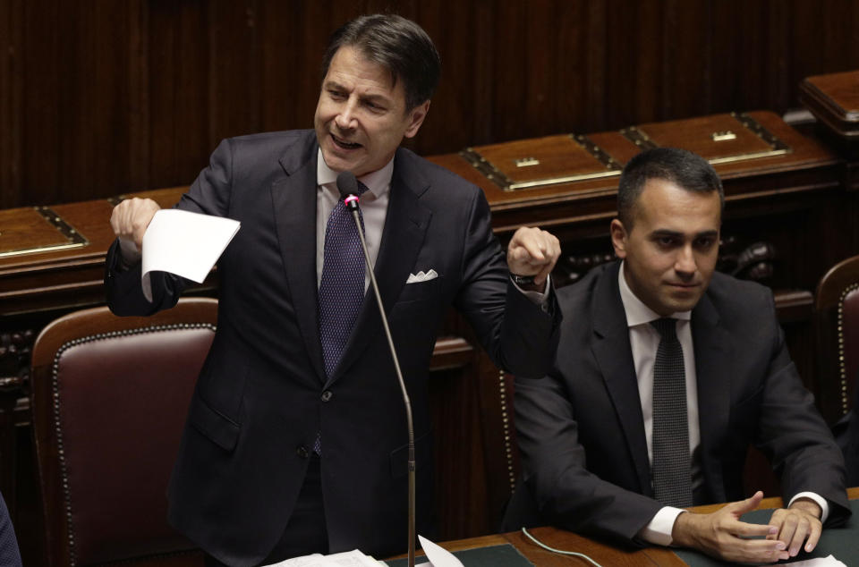 Italian Premier Giuseppe Conte, flanked by Foreign Minister Luigi Di Maio, intervenes in the parliament debate ahead of confidence vote later at the Lower Chamber in Rome, Monday, Sept. 9, 2019. Conte is pitching for support in Parliament for his new left-leaning coalition ahead of crucial confidence votes. (AP Photo/Gregorio Borgia)