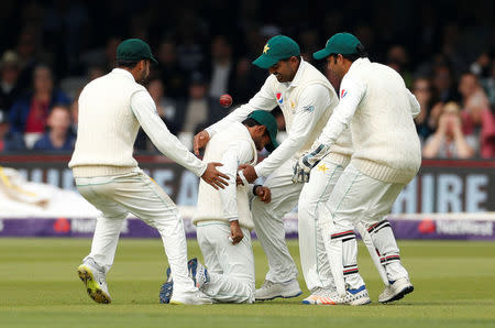 Cricket - England vs Pakistan - First Test - Lord's Cricket Ground, London, Britain - May 24, 2018 Pakistan's Asad Shafiq celebrates after catching out England's Jos Buttler Action Images via Reuters/John Sibley