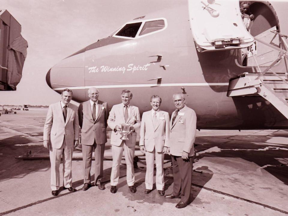 Herb Kelleher (left) Lamar Muse (second from left) and Rollin King (center)