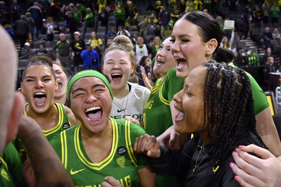 Oregon players celebrate their victory over Washington after an NCAA college basketball game in the first round of the Pac-12 women's tournament Wednesday, March 1, 2023, in Las Vegas. (AP Photo/David Becker)