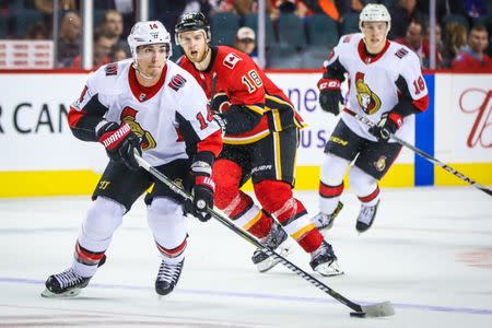 Oct 13, 2017; Calgary, Alberta, CAN; Ottawa Senators right wing Alexandre Burrows (14) controls the puck against the Calgary Flames during the third period at Scotiabank Saddledome. Ottawa Senators won 6-0. Mandatory Credit: Sergei Belski-USA TODAY Sports