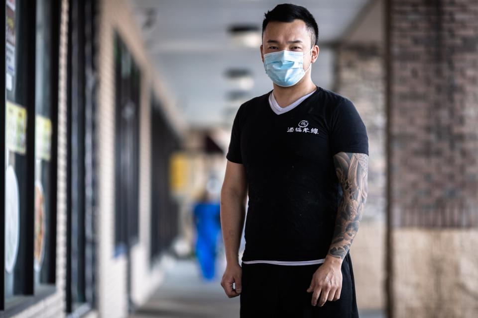 Shuai Yang, co-owner of LanZhou Ramen restaurant on Buford Highway in Doraville, Georgia, stands for a photo.