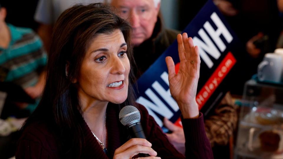 PHOTO: Republican presidential candidate and former UN Ambassador Nikki Haley talks to a group of people while campaigning at the historic Robie Country Store, Jan. 18, 2024, in Hooksett, N.H. (Chip Somodevilla/Getty Images)