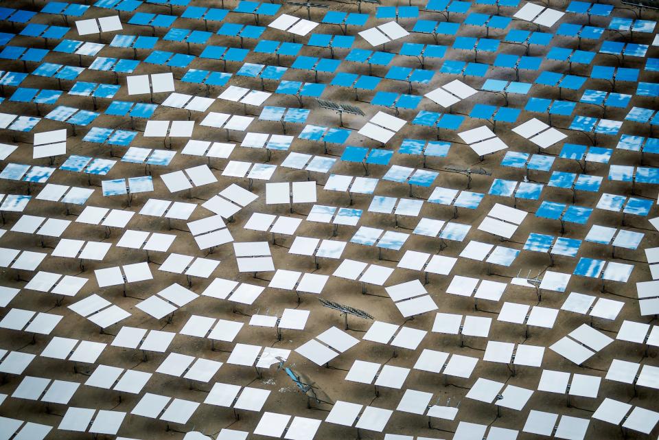 Solar panels stand at the Ivanpah Solar Electric Generating System in the Mojave Desert near Primm, Nevada, U.S., on Monday, March 10, 2014. The 392-megawatt California Ivanpah plant developed by Google, NRG and Bright Source, which began operating in February, brings utility-scale solar to more than 5.5 gigawatts, up 1,089% since 2010. Photographer: Jacob Kepler/Bloomberg via Getty Images