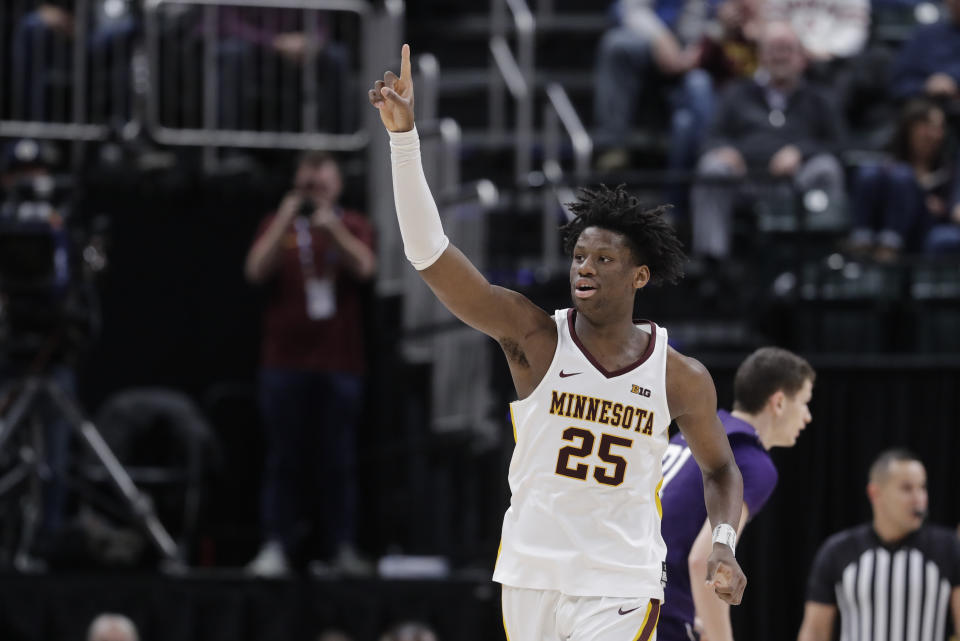 Minnesota's Daniel Oturu (25) reacts during the second half of an NCAA college basketball game against Northwestern at the Big Ten Conference tournament, Wednesday, March 11, 2020, in Indianapolis. Minnesota won 74-57. (AP Photo/Darron Cummings)