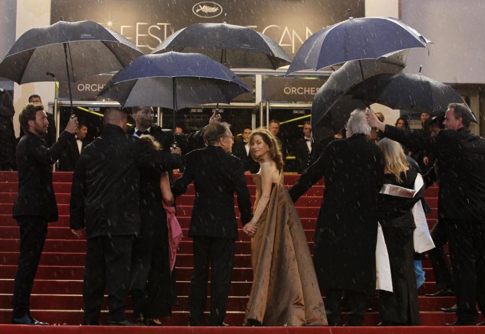 Actors Jean-Louis Trintignant, third left, Isabelle Huppert and director Michael Haneke arrive for the screening of Love at the 65th international film festival, in Cannes, southern France, Sunday, May 20, 2012. (AP Photo/Francois Mori)