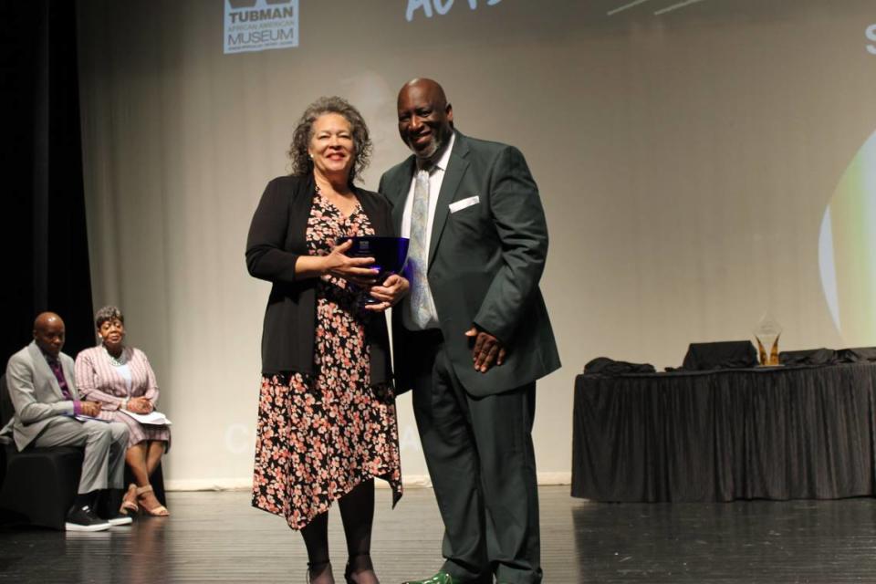 Starr Purdue, left, receives the Harriet Tubman Acts of Courage Award at the inaugural Central Georgia Women of Impact Awards held on Saturday.