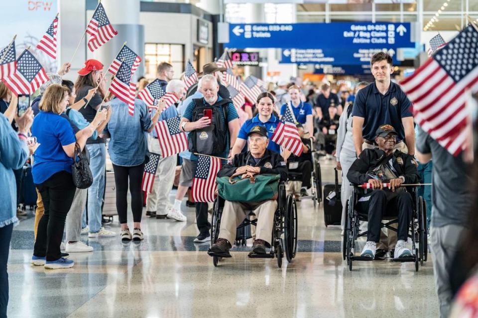 More than 60 veterans of World War II took off from Dallas to France on Friday to participate in ceremonies marking the 80th anniversary of D-Day. The group, ranging in age from 95 to 107, is being flown by American Airlines to Paris. The image shows the veterans heading to their gate the airport to go on their anniversary trip to Normandy.