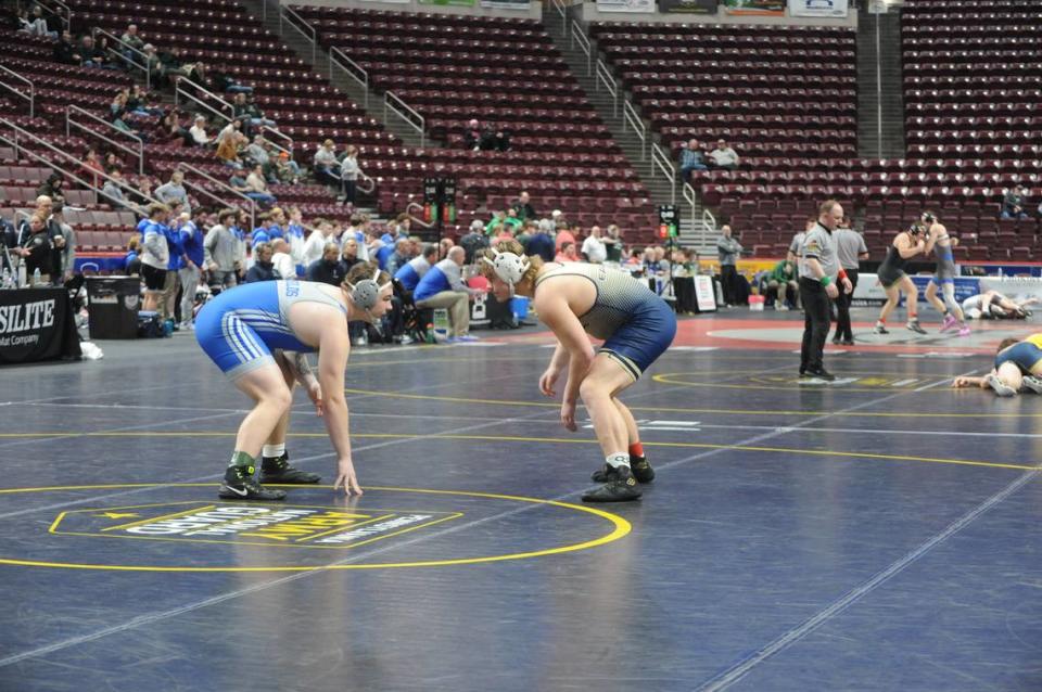 Bald Eagle Area’s Gage Gardner (right) looks for an opening on Reynolds’ Kolton Wilkinson in their 215-pound bout of the Eagles’ 27-25 loss on Friday in the PIAA Class 2A dual championships consolation first round. Gardner won 3-0.