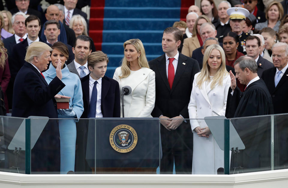 <p>JAN. 20, 2017 – Donald Trump is sworn in as the 45th president of the United States by Chief Justice John Roberts as Melania Trump and his family looks on during the 58th Presidential Inauguration at the U.S. Capitol in Washington, D.C. (Photo: Patrick Semansky/AP) </p>